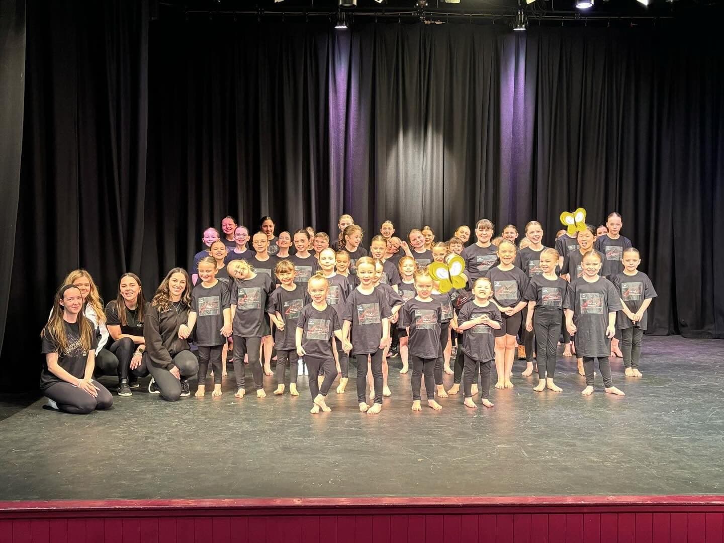 Showcase finale with the full cast on stage